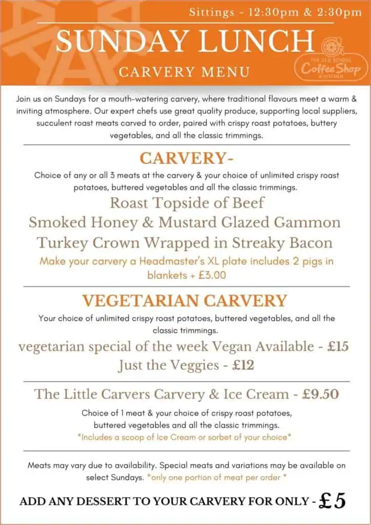 Exterior view of The Old School Coffee Shop & Kitchen with a bright orange signage and welcoming entrance.