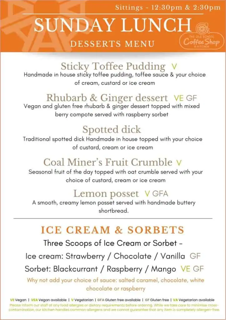 Menu board displaying Sunday lunch options including sticky toffee pudding, rhubarb and ginger dessert, spotted dick, coal miner's fruit crumble, lemon posset, and ice cream and sorbets.